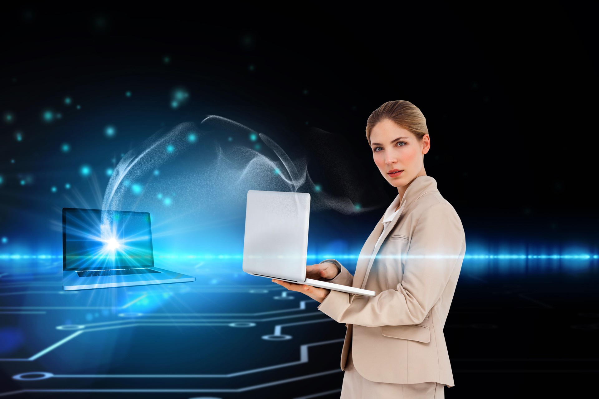 Businesswoman using laptop connected